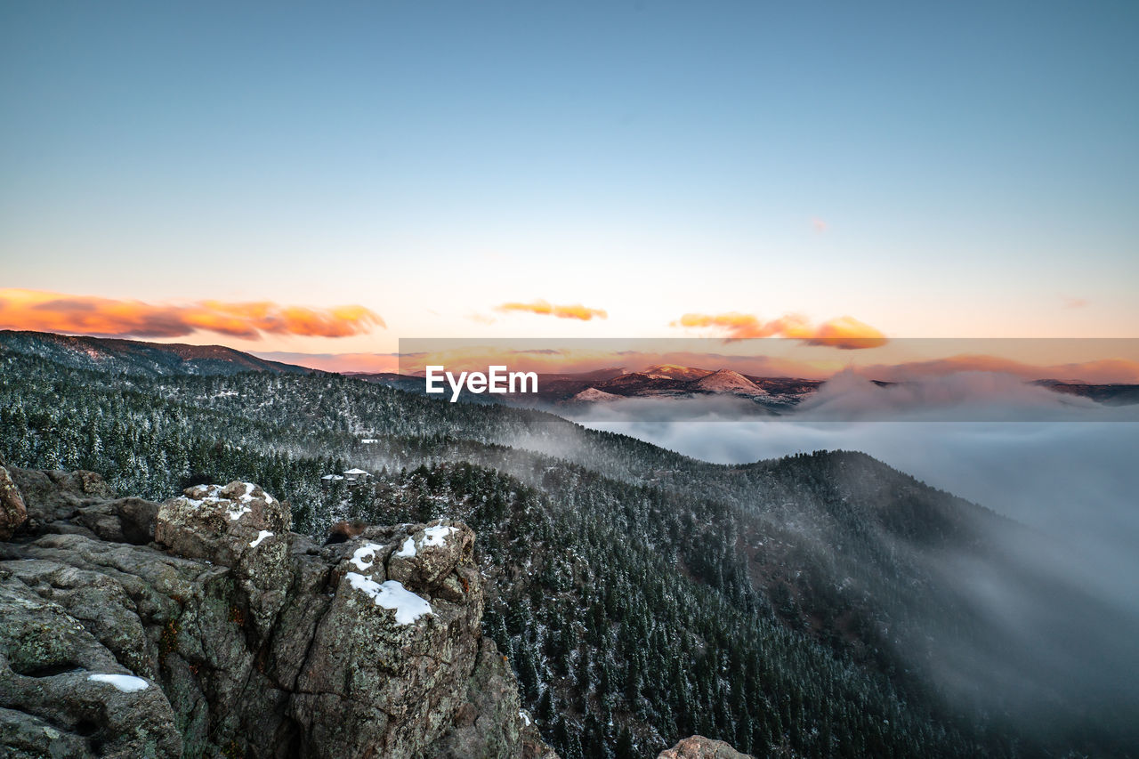 Scenic view of mountains against sky during sunset