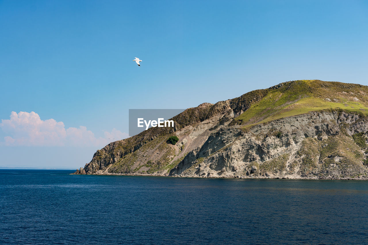 Scenic view of sea against clear blue sky