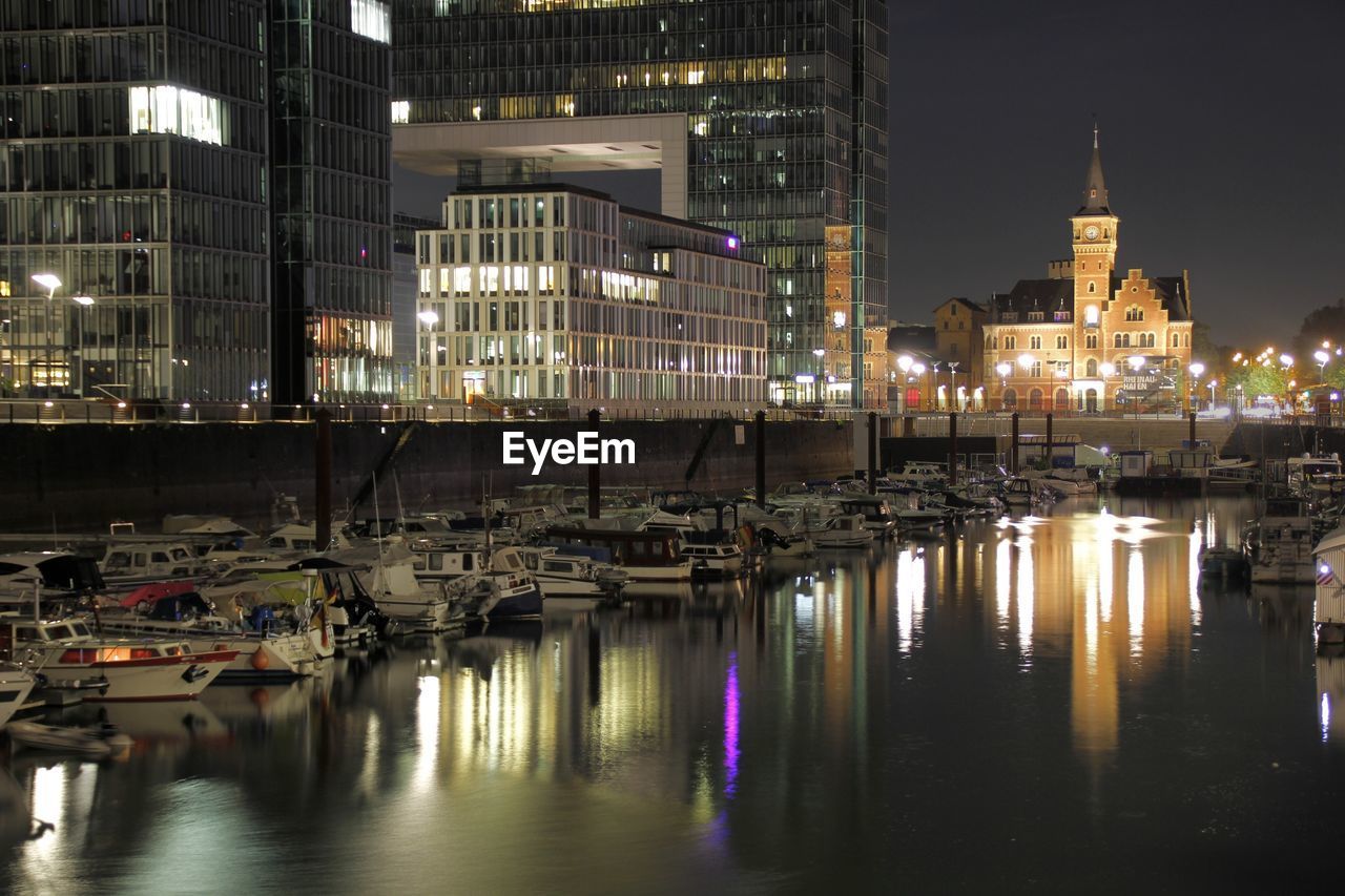 Reflection of illuminated buildings in water at night