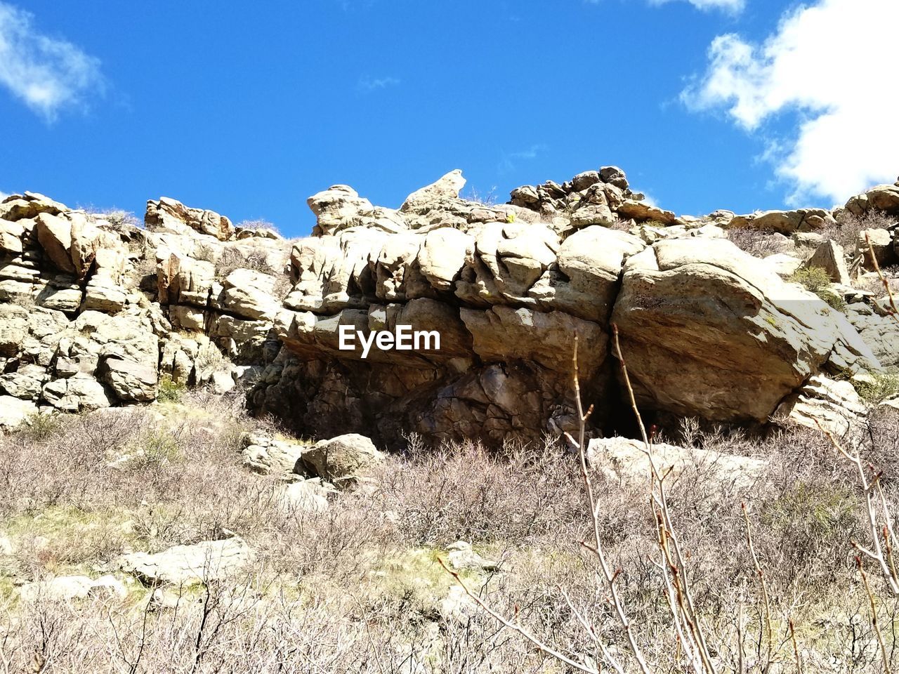 Rock formation on land against sky