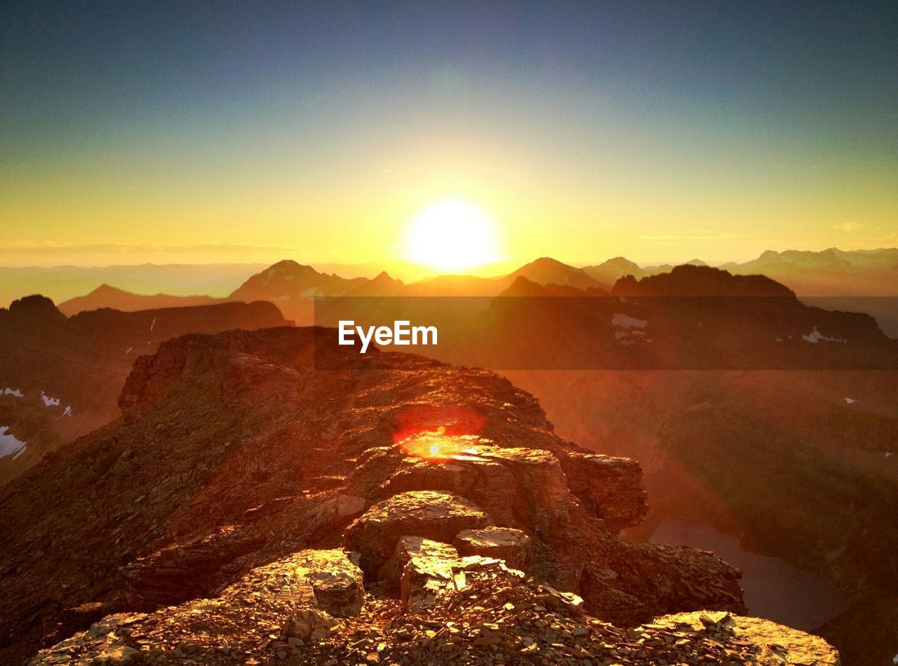 Scenic view of mountains against sky during sunset