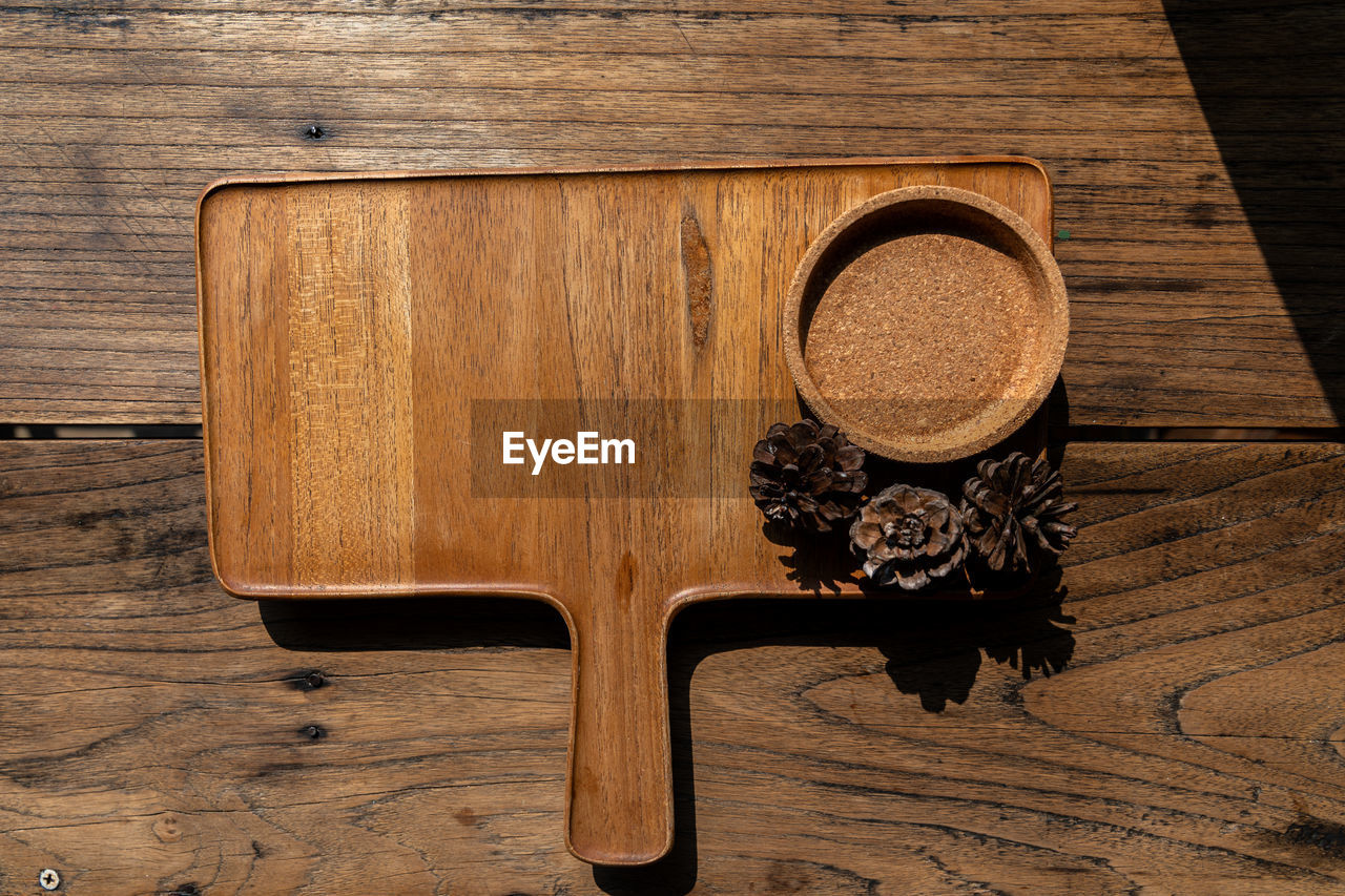 wood, table, indoors, cutting board, no people, brown, furniture, food and drink, directly above, high angle view, still life, wood grain, household equipment, kitchen utensil