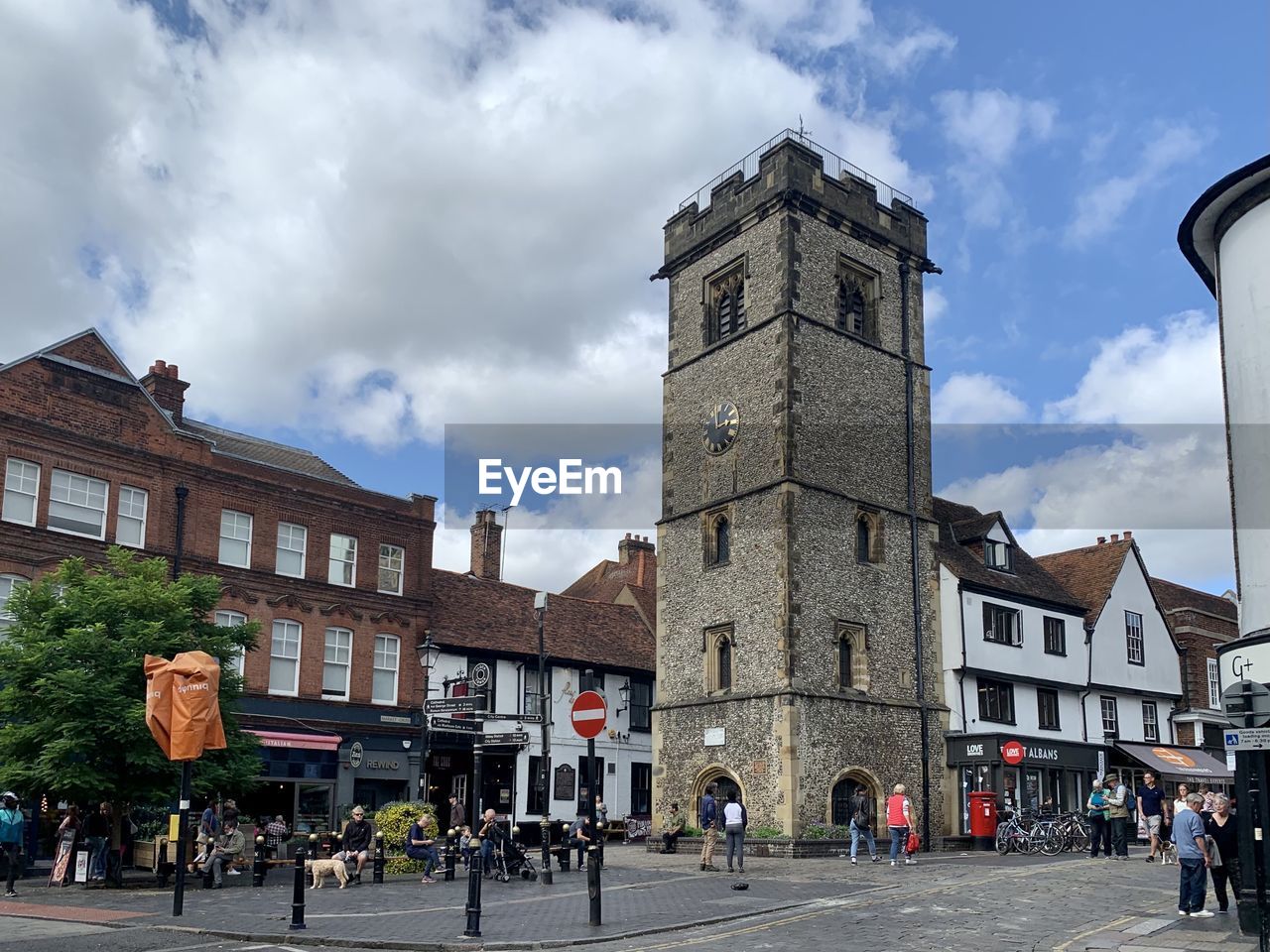 Street view of st albans medieval town, hertfordshire, england, uk. market place, clock tower