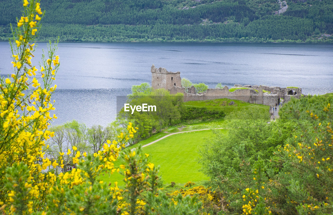 Scenic view of river amidst trees scottish castle