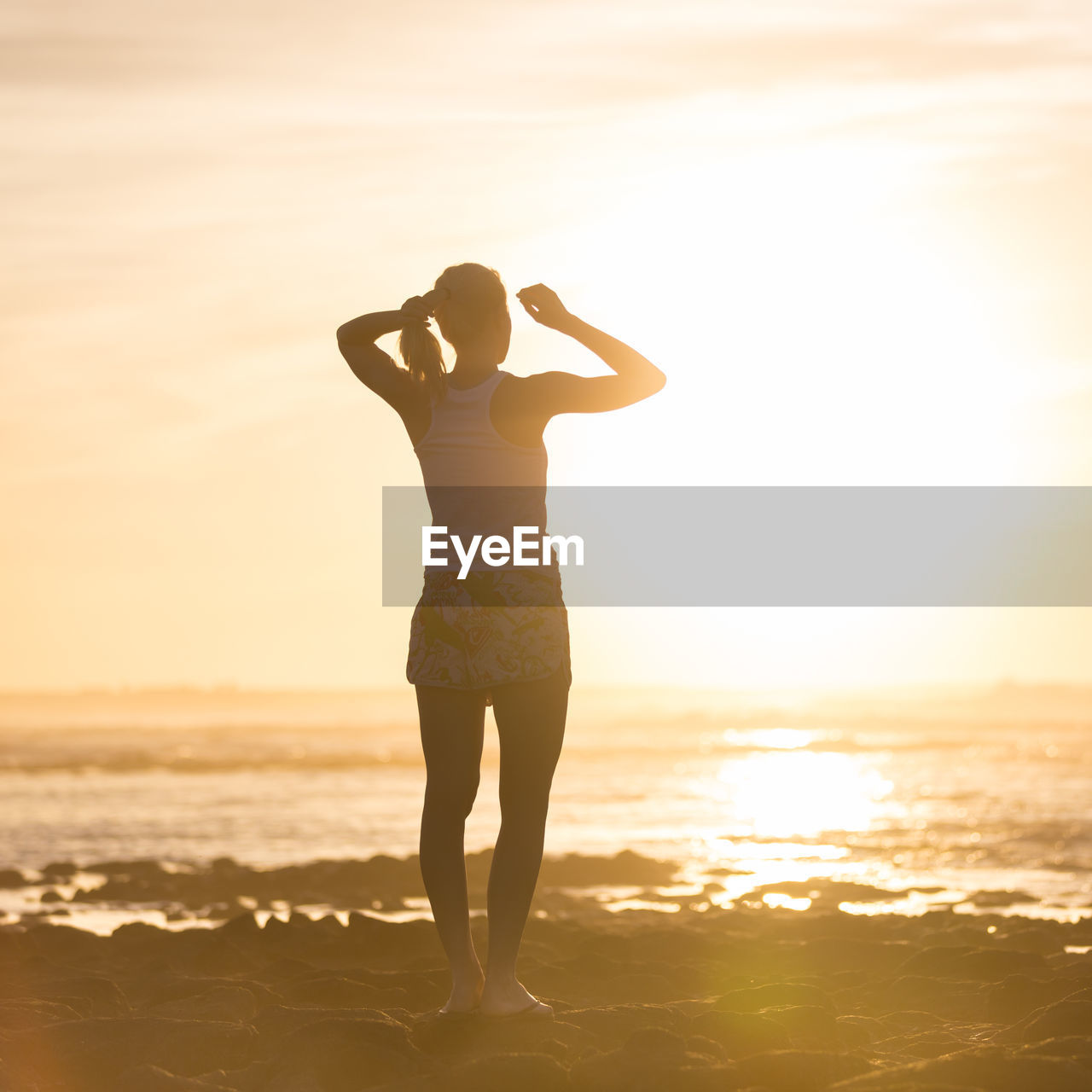 FULL LENGTH OF WOMAN STANDING ON BEACH