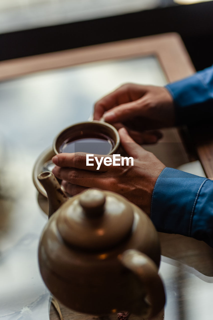Woman's hands holding coffee