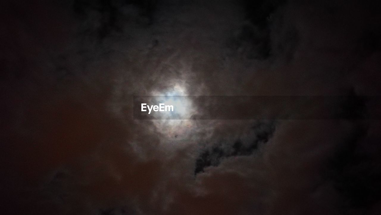 LOW ANGLE VIEW OF MOON AGAINST SKY AT NIGHT