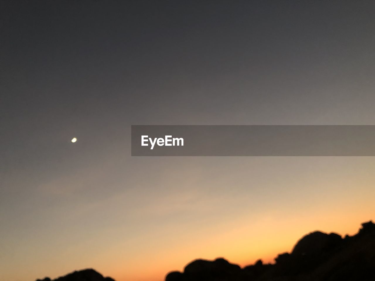 SCENIC VIEW OF MOON AGAINST SKY AT SUNSET