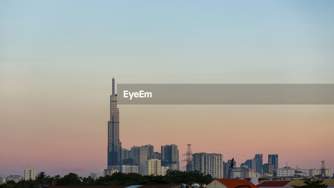 View of landmark 81 and other houses in ho chi minh city on sunset, vietnam