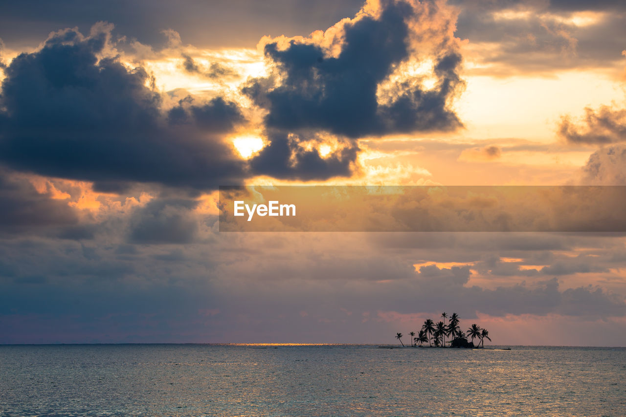 Scenic view of sea against storm clouds