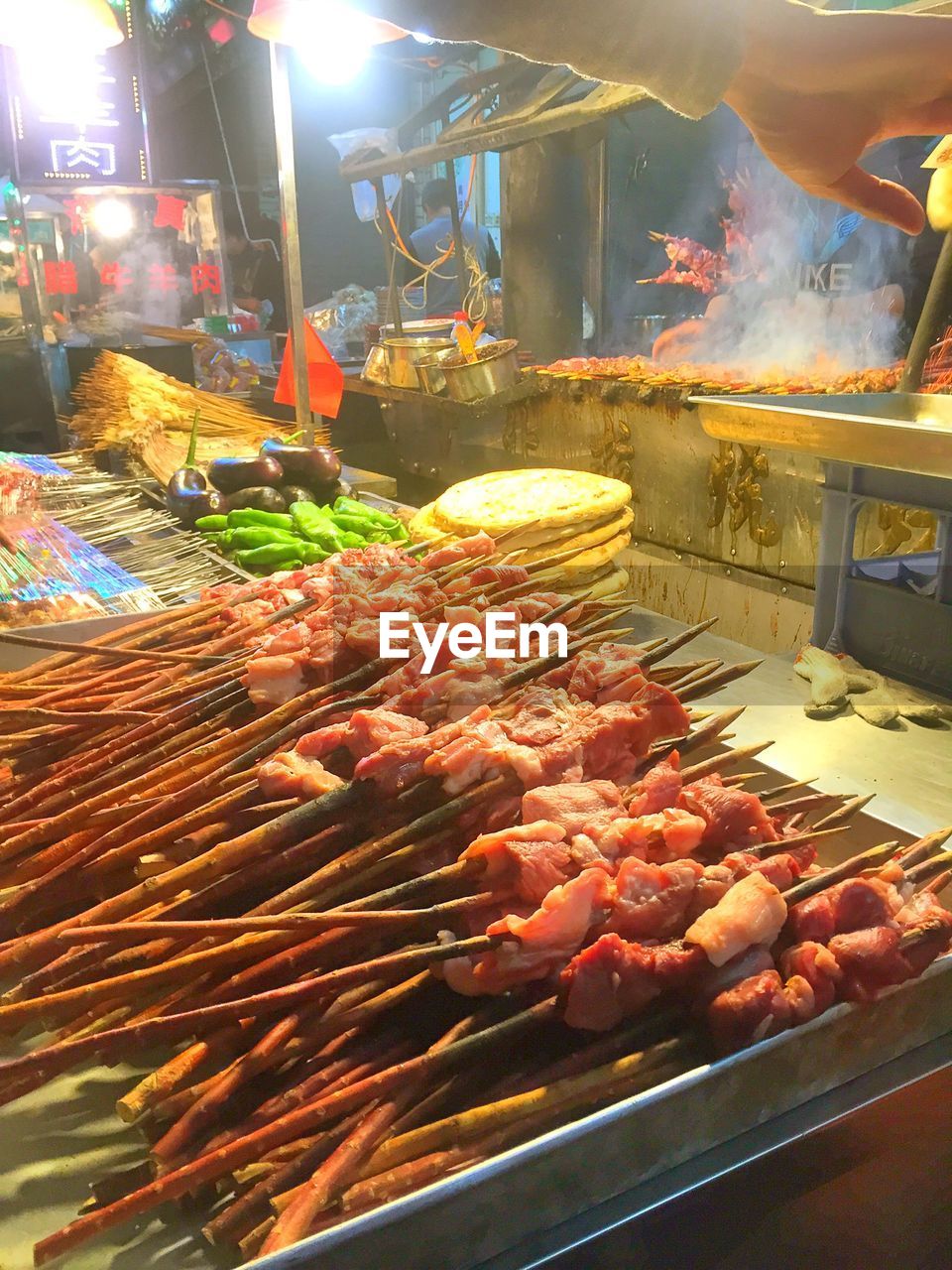 Meat skewers for sale at market during night