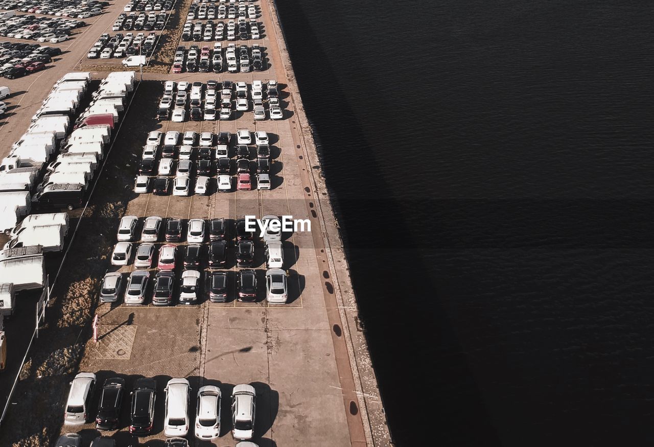 High angle view of cars parked at harbor