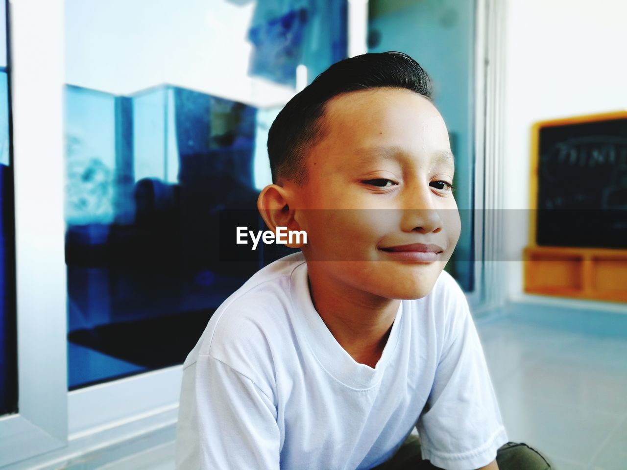 Portrait of boy looking at home