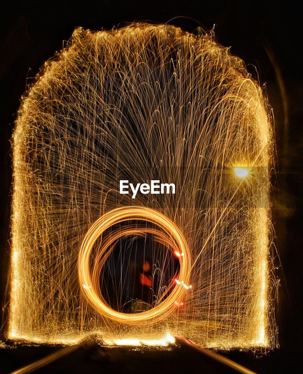 Spinning wire wool at night