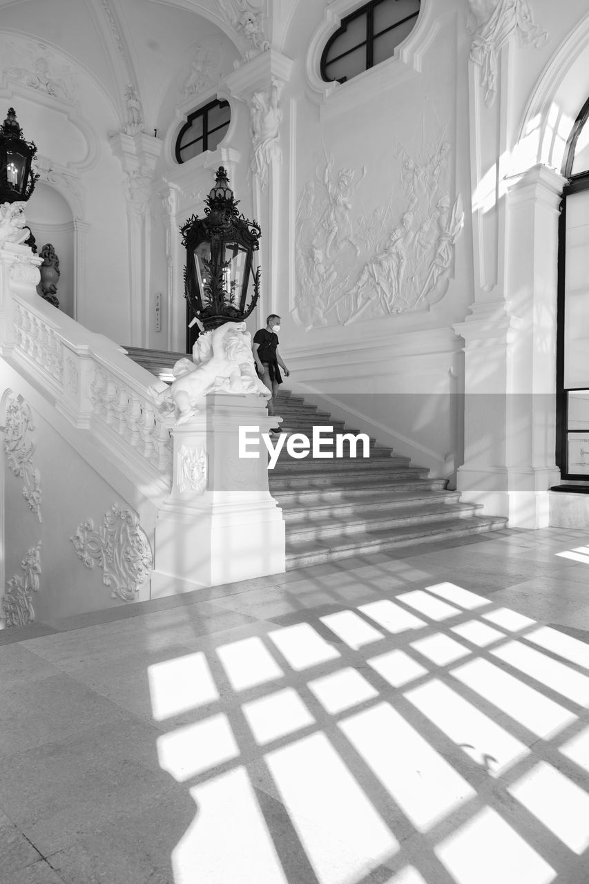 white, architecture, black and white, built structure, indoors, monochrome photography, monochrome, sunlight, building, no people, flooring, staircase, arch, shadow, wealth, black, interior design, marble, day, luxury, tiled floor, architectural column, floor, tile, ornate, house, nature, home interior, religion, mansion, entrance