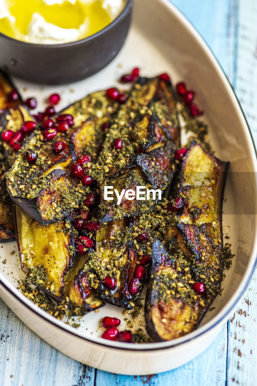 High angle view of roasted eggplant in dish on table