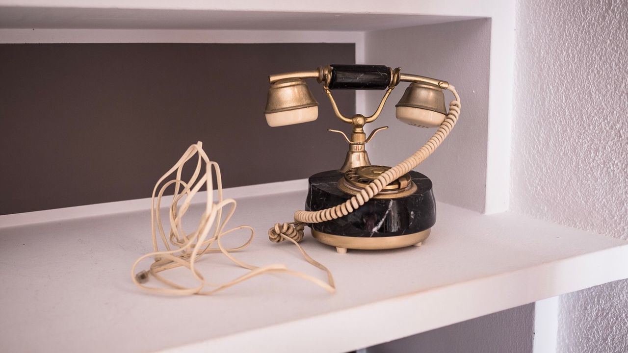 Close-up of vintage telephone on table