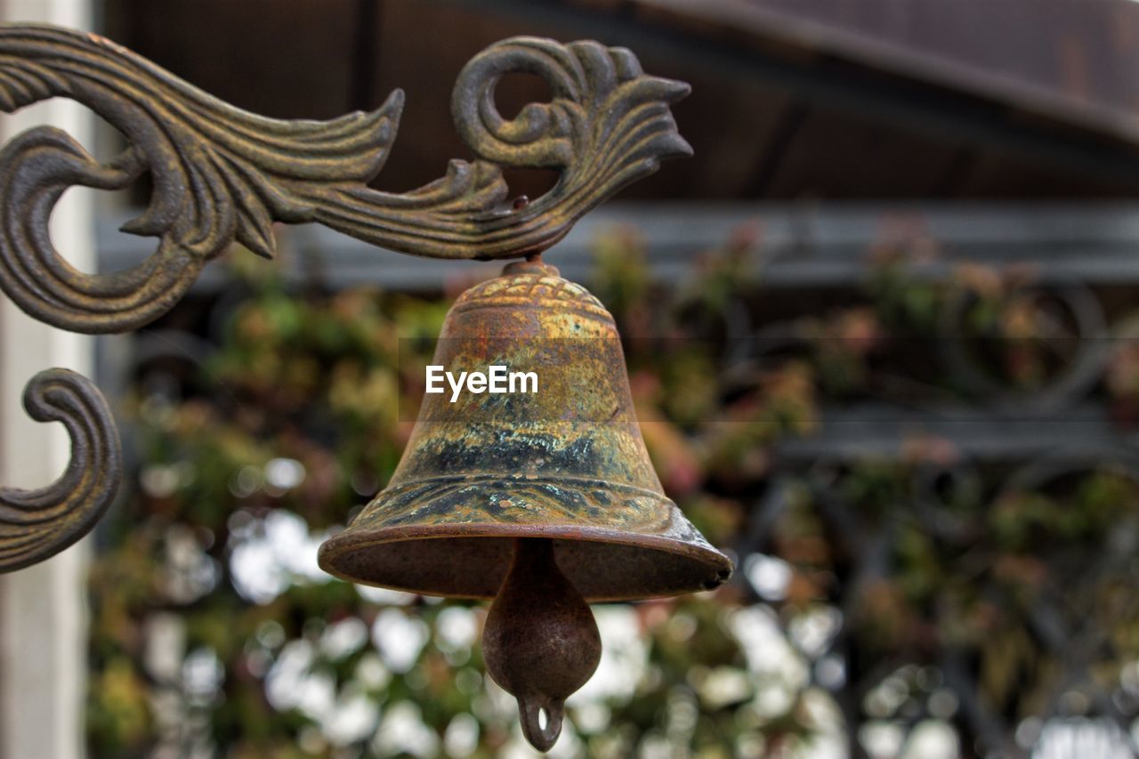 LOW ANGLE VIEW OF OLD BELL HANGING