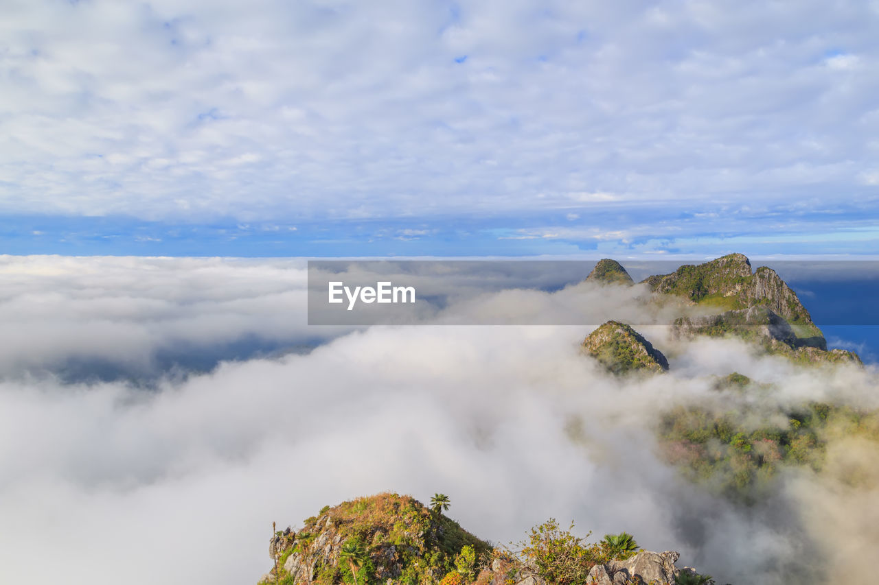 SCENIC VIEW OF CLOUDS OVER MOUNTAIN