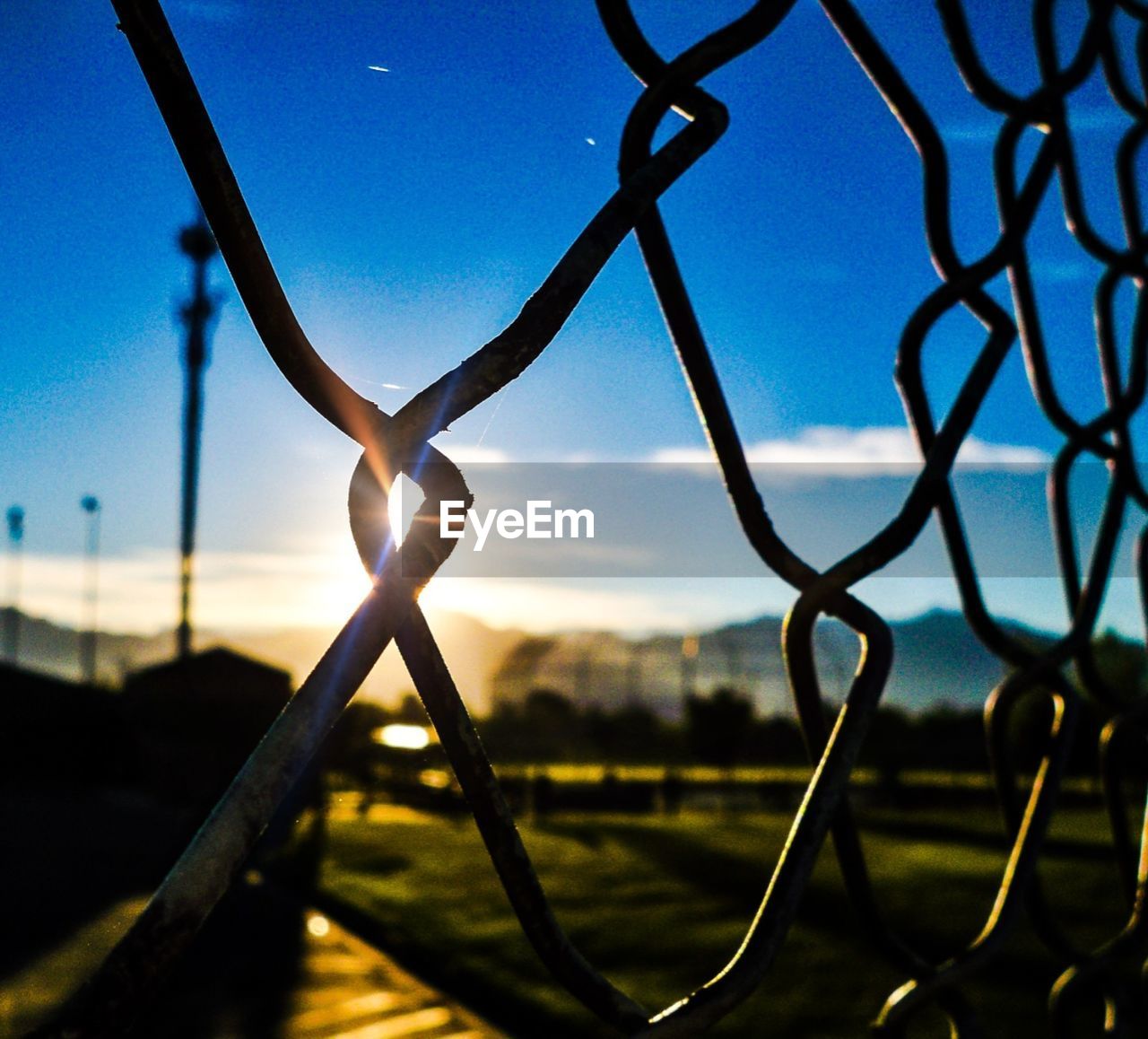 CLOSE-UP OF METAL AGAINST SKY