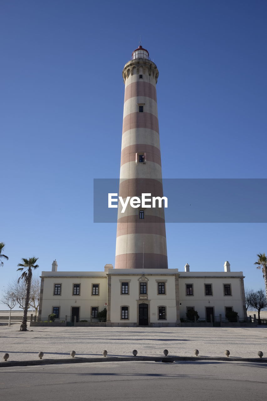 LOW ANGLE VIEW OF BUILT STRUCTURE AGAINST CLEAR BLUE SKY