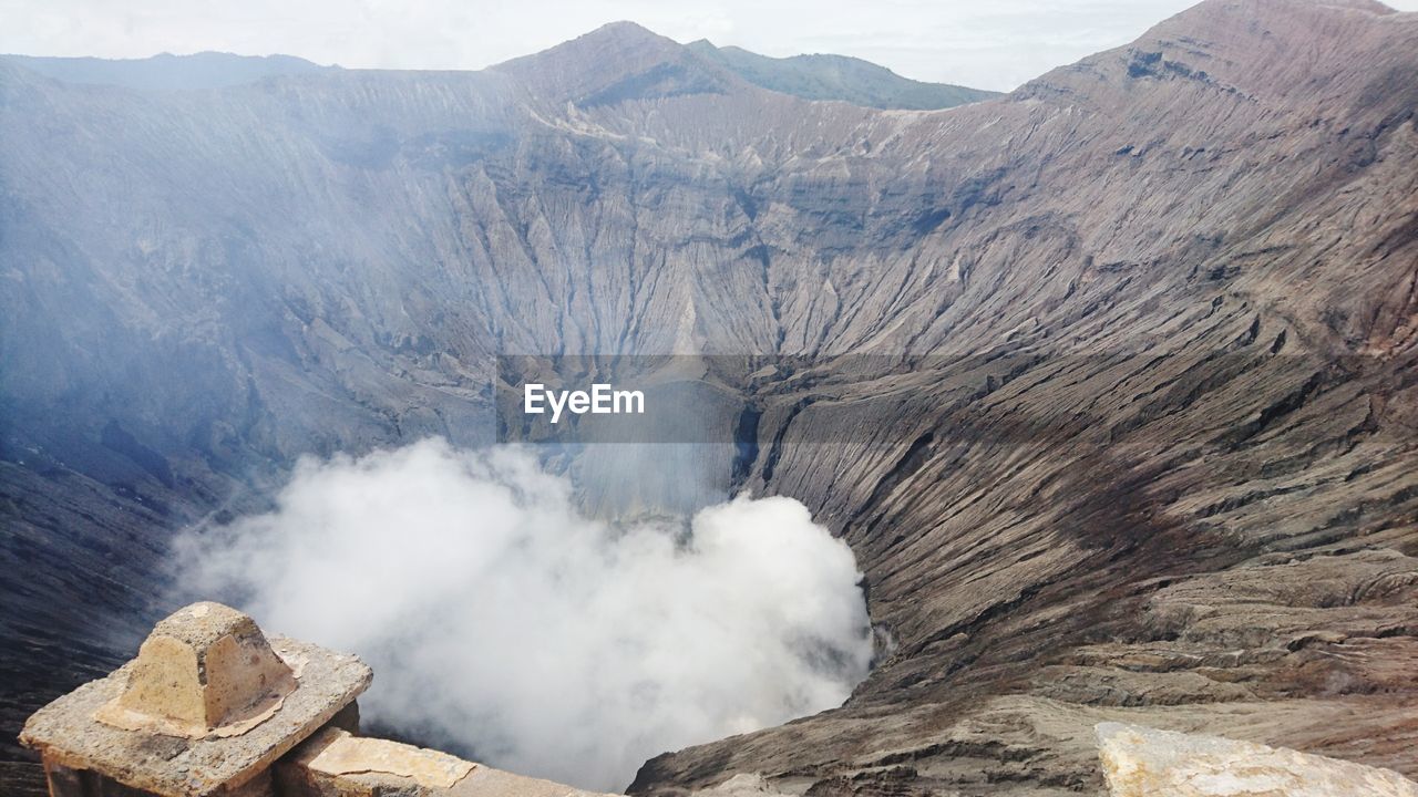Smoke emitting from volcanic mountain