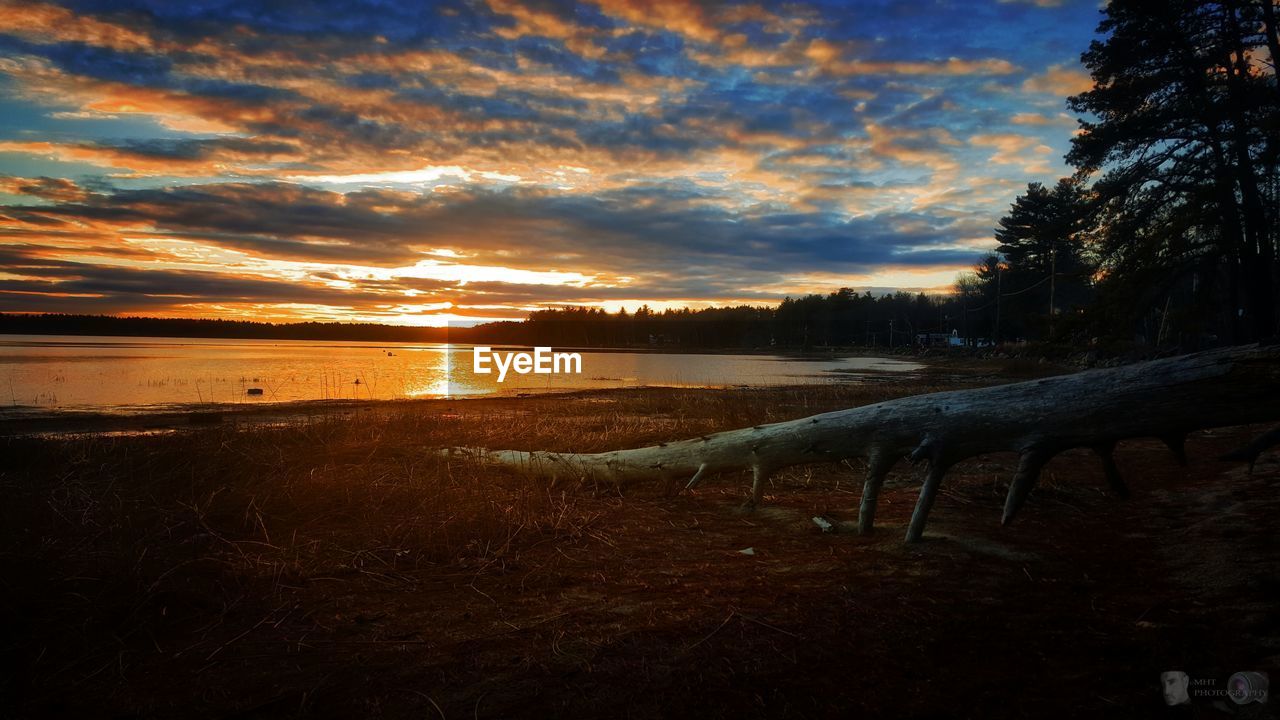 View of calm lake at sunset