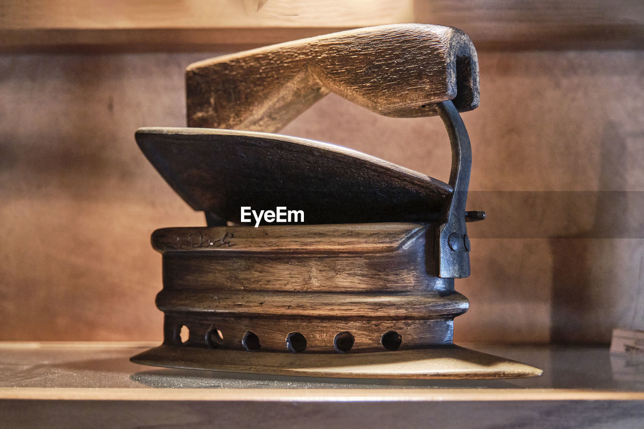 CLOSE-UP OF OLD MACHINE ON TABLE