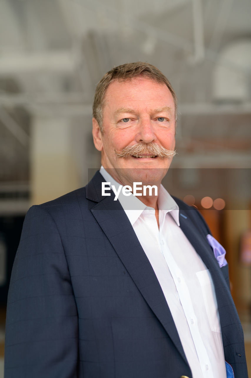 Portrait of senior man wearing suit