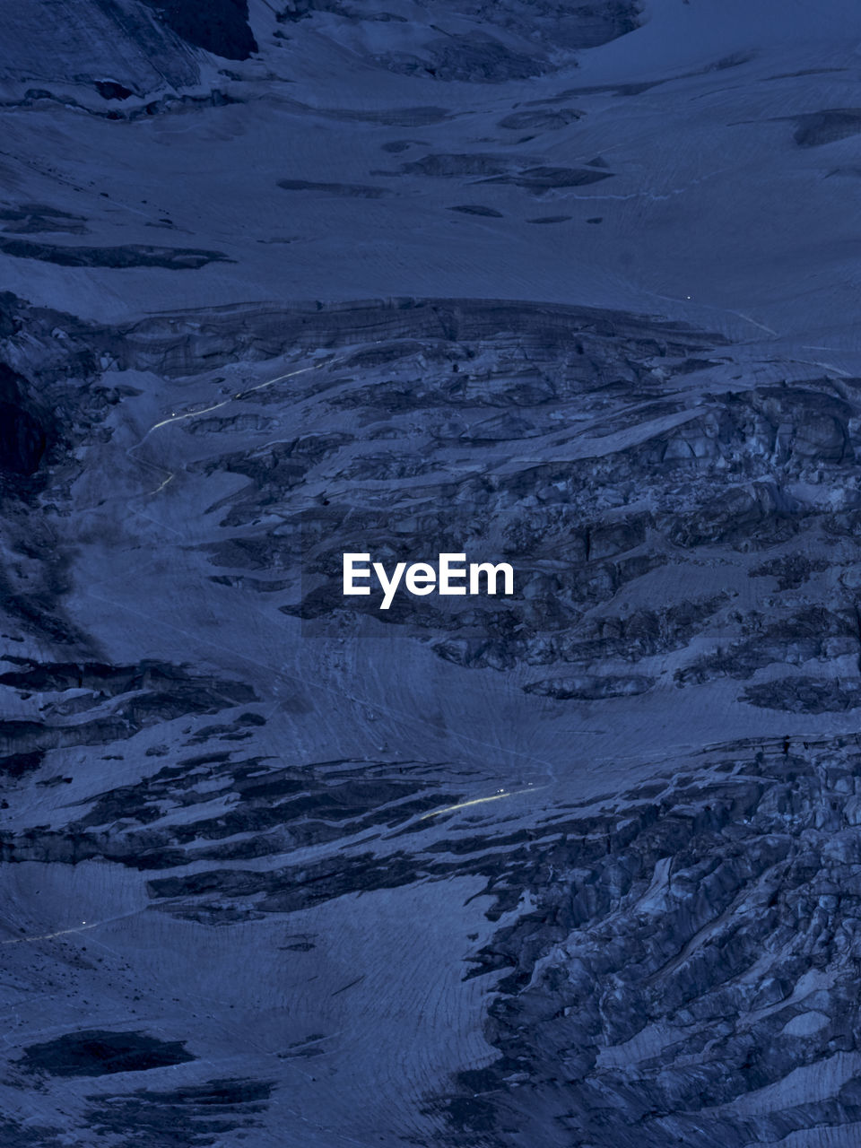 HIGH ANGLE VIEW OF SNOW COVERED LAND AND SNOWCAPPED LANDSCAPE