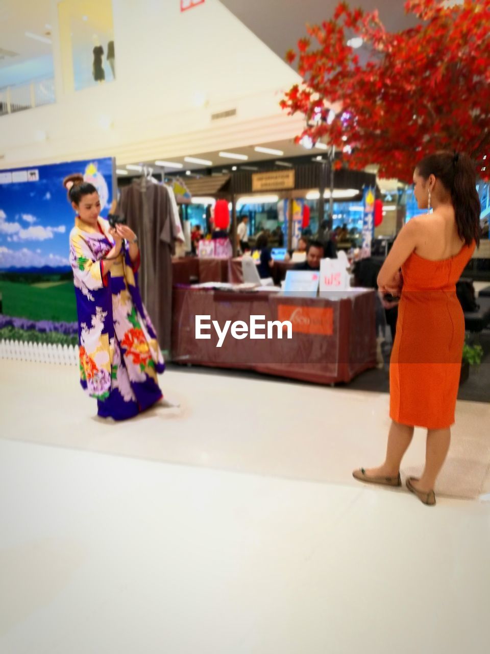 FULL LENGTH OF WOMAN STANDING IN SHOPPING CART