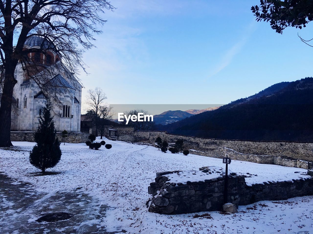 Snow covered landscape against sky