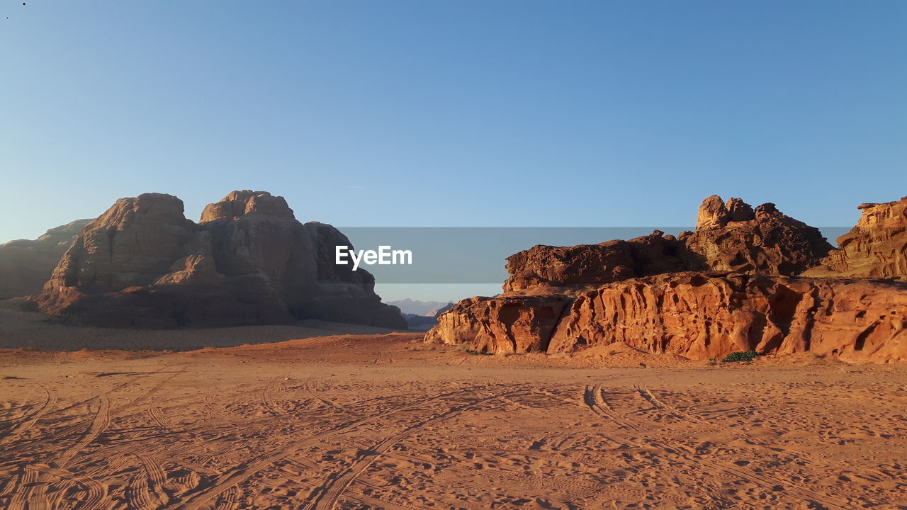 View of desert against blue sky