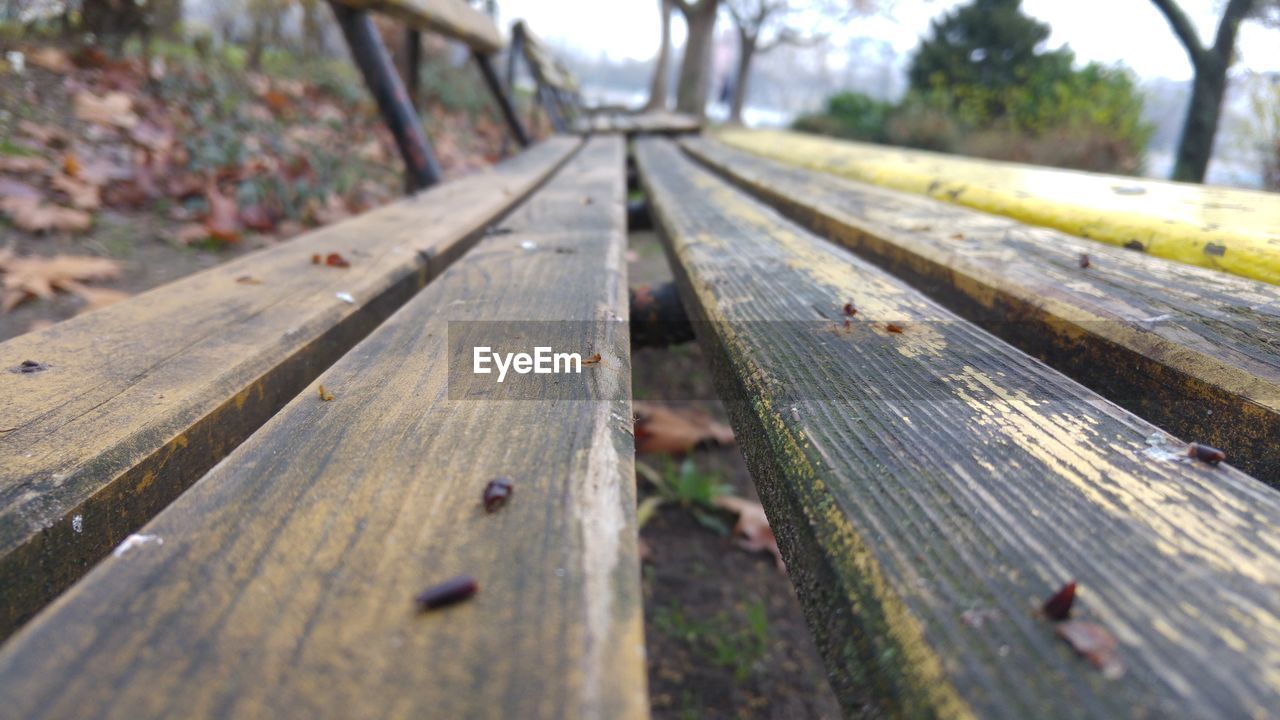 CLOSE-UP OF BENCH ON RAILROAD TRACKS