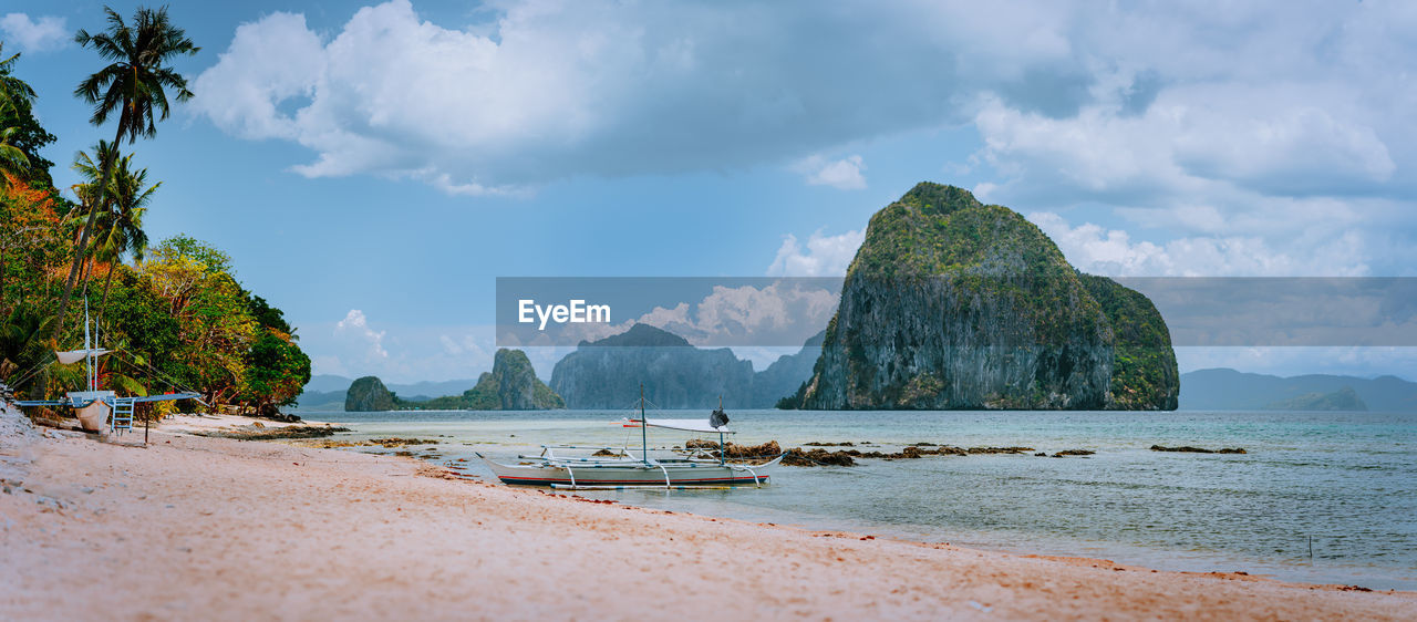 PANORAMIC SHOT OF BEACH AGAINST SKY