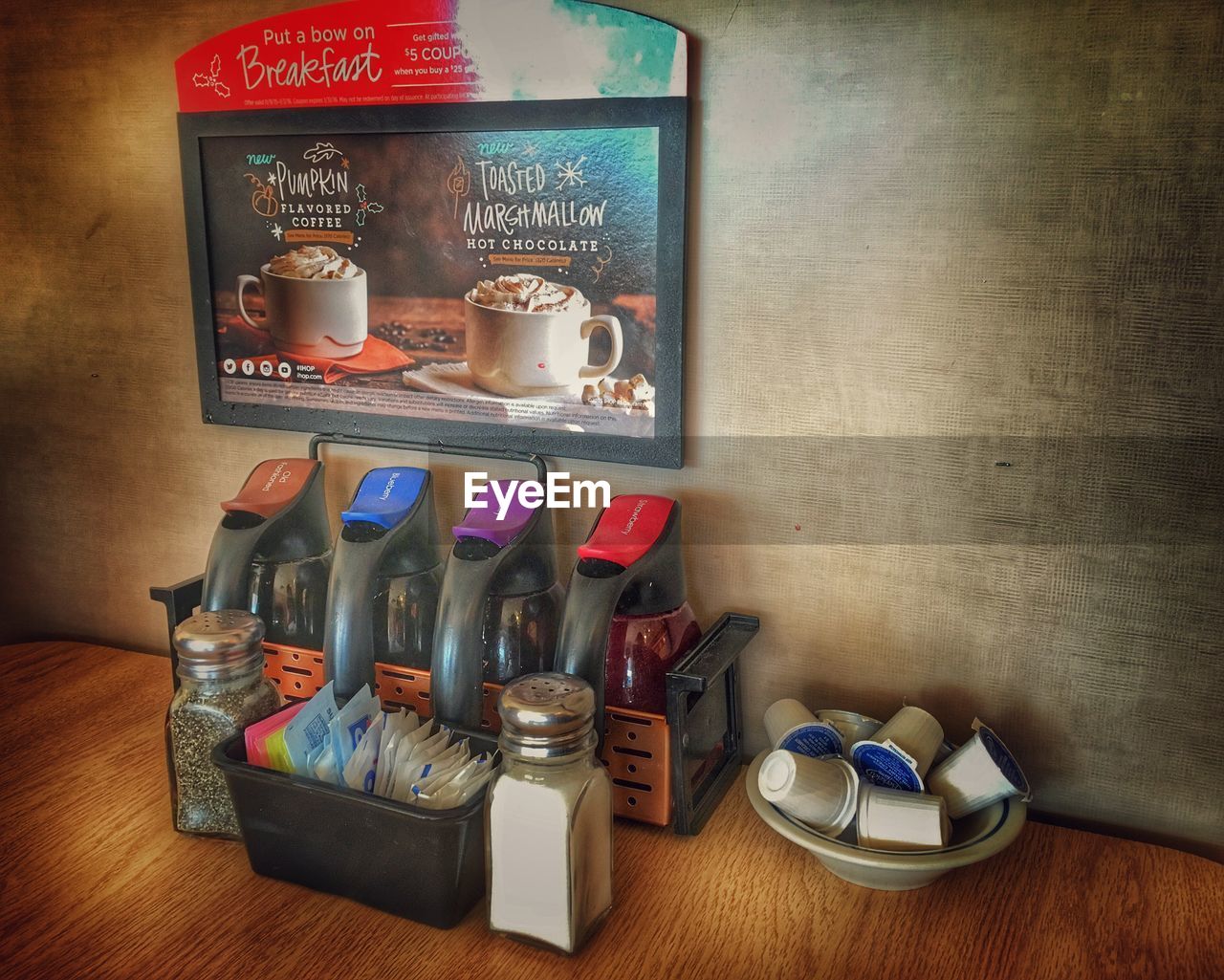 FULL FRAME SHOT OF BOTTLES ON TABLE