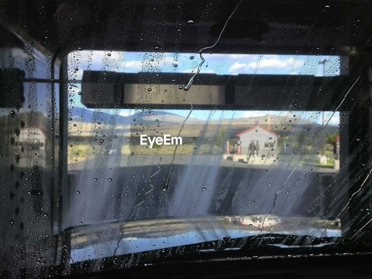 CLOSE-UP OF WET CAR WINDOW