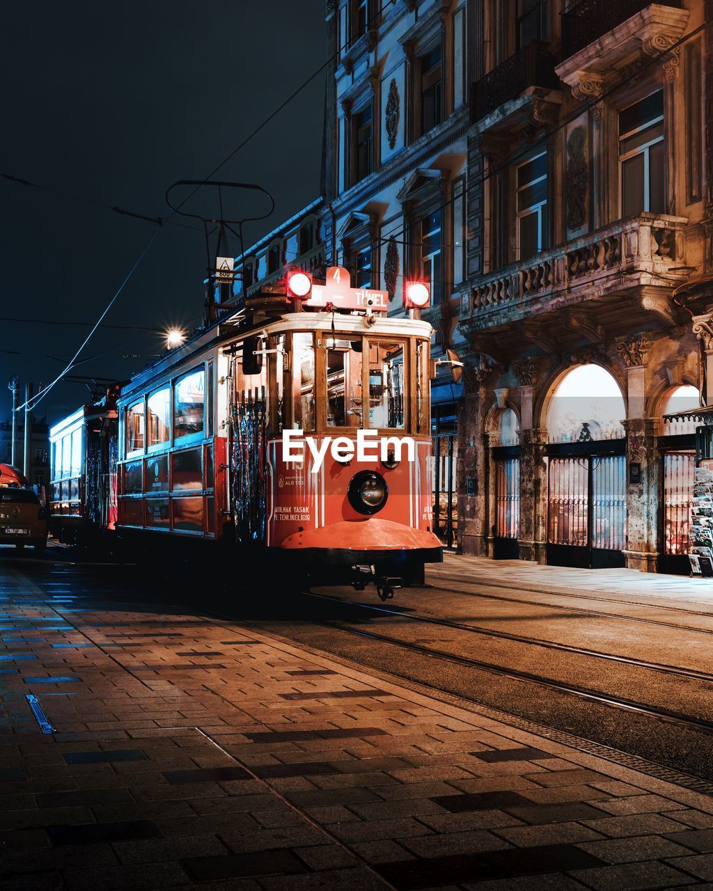 Cars on illuminated city at night