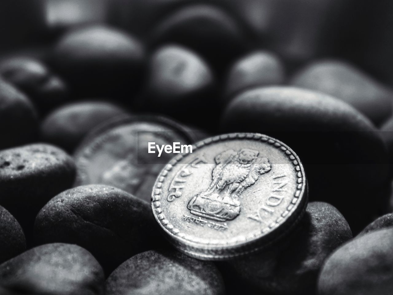 CLOSE-UP OF COINS ON FLOOR