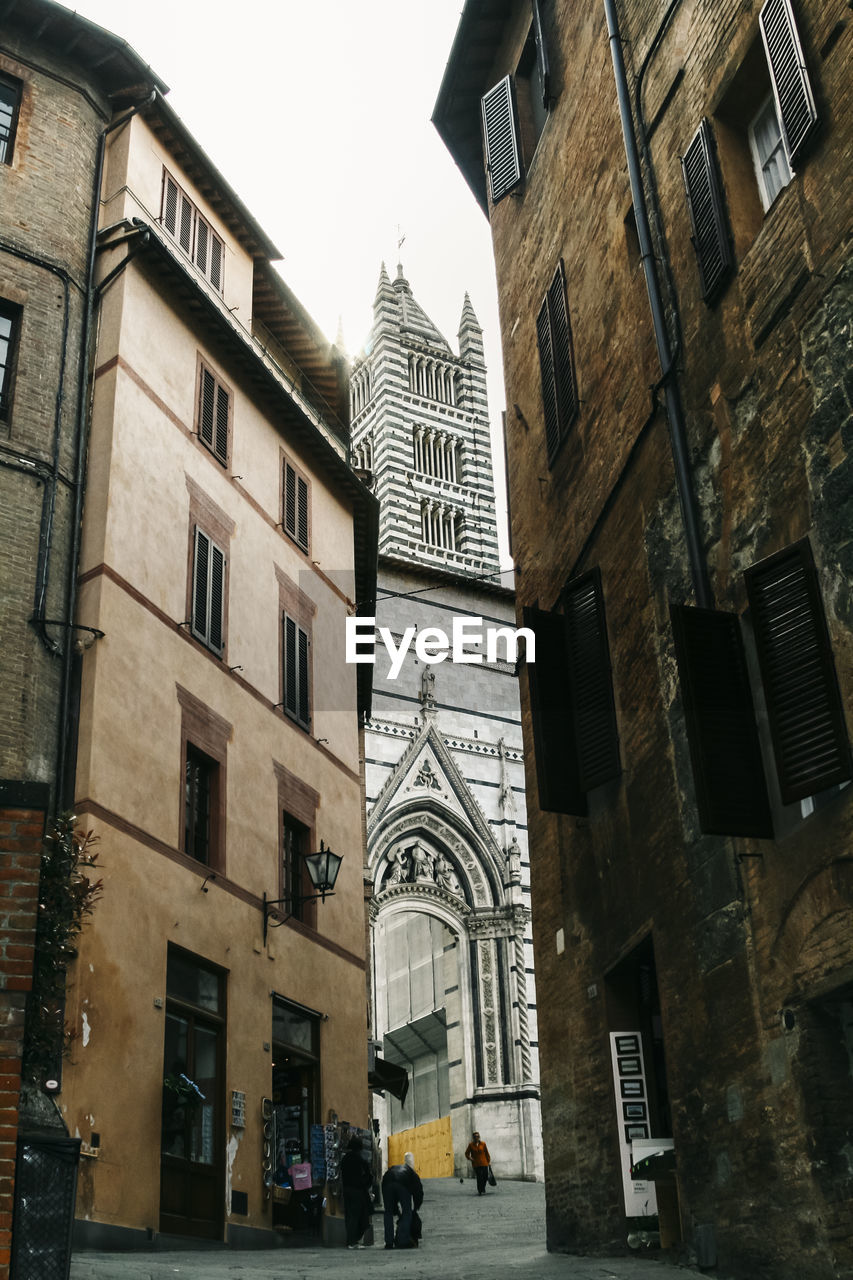 LOW ANGLE VIEW OF BUILDINGS BY STREET