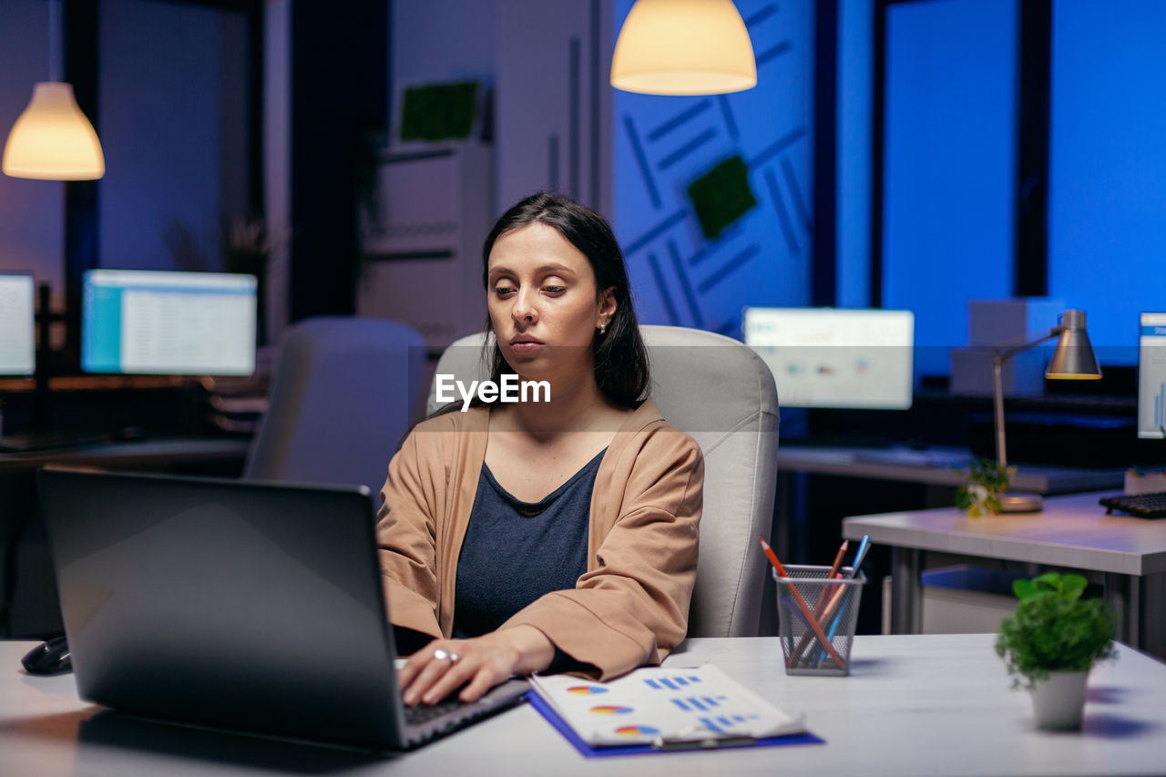 Tired businesswoman working in office