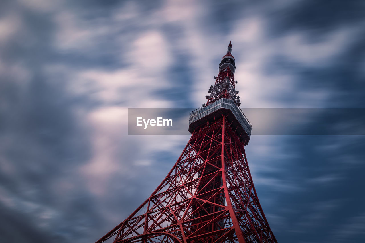 Tokyo tower view against cloudy sky.