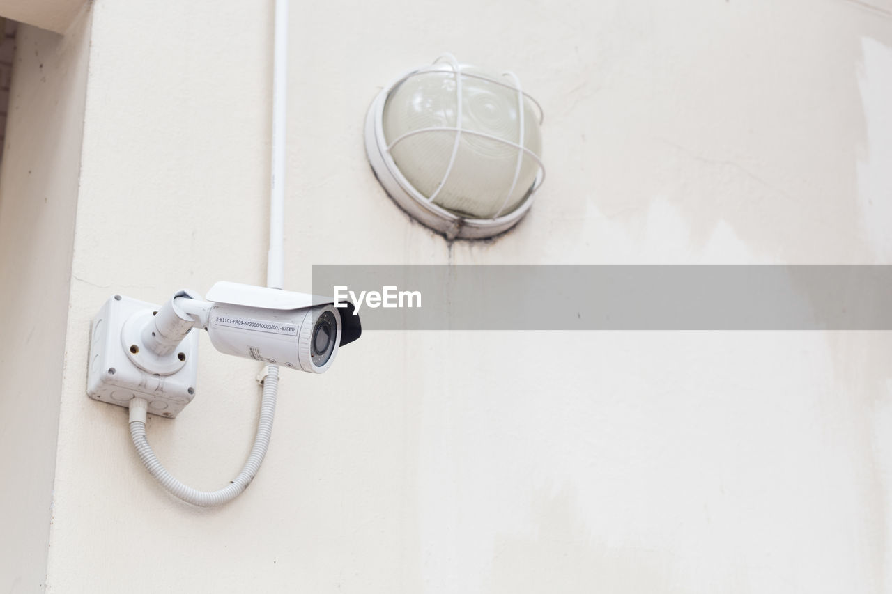 close-up of security camera against wall