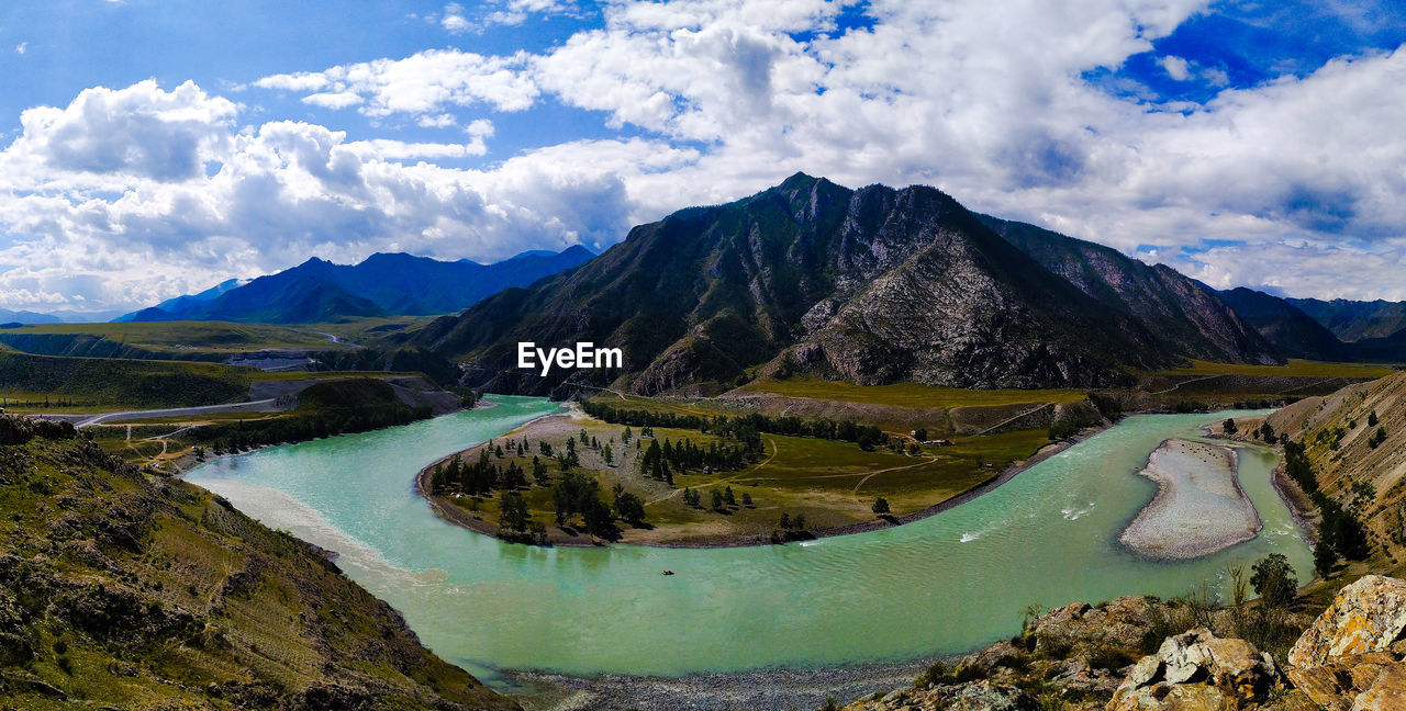 Scenic view of lake and mountains against sky