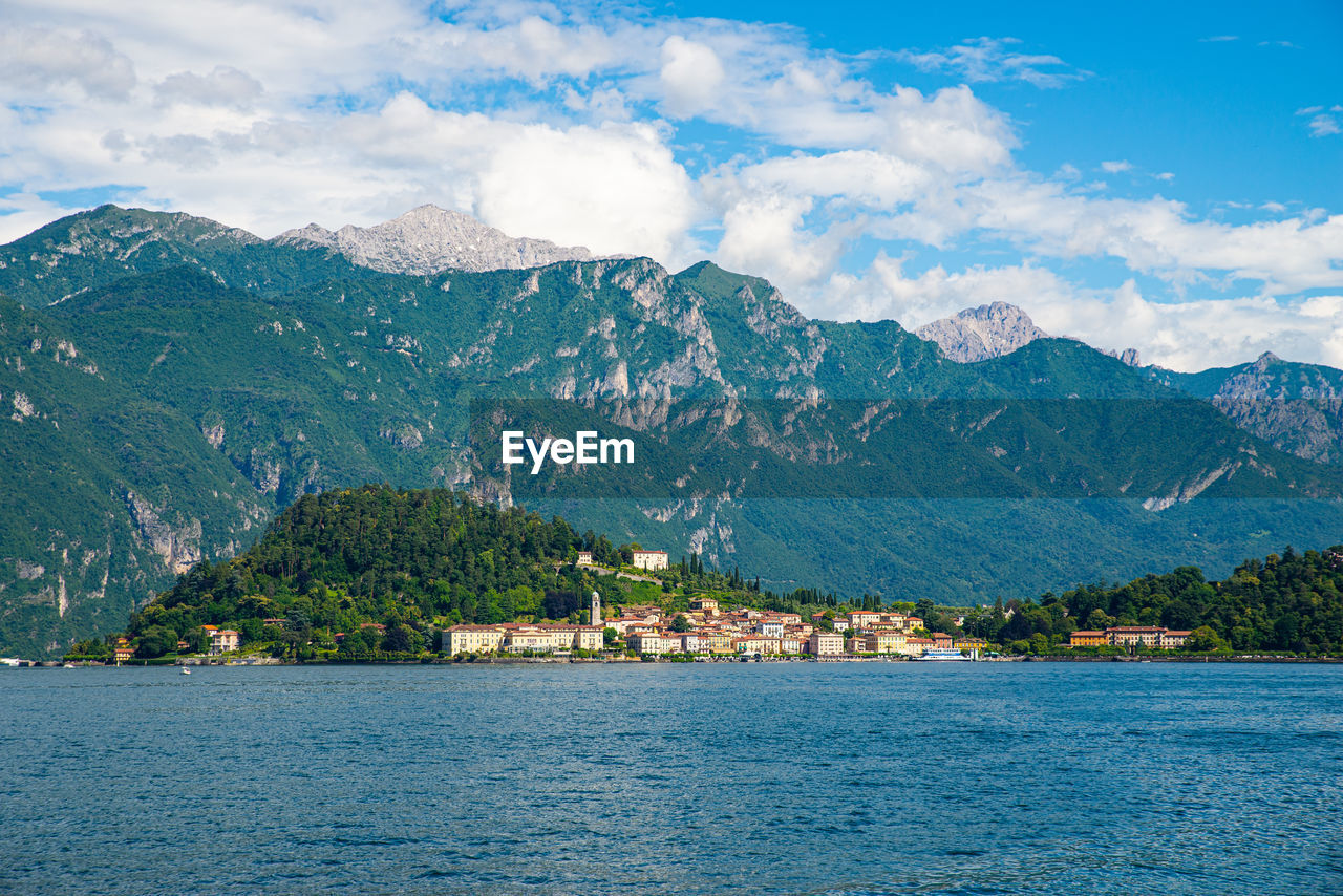 The panorama of lake como, photographed in tremezzo, showing the mountains, the town of bellagio.