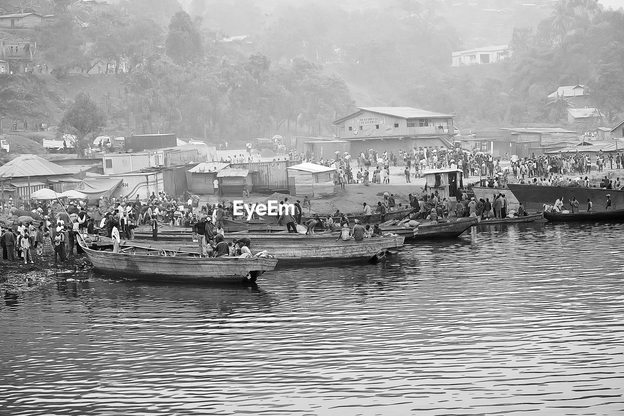 People on boat at riverbank