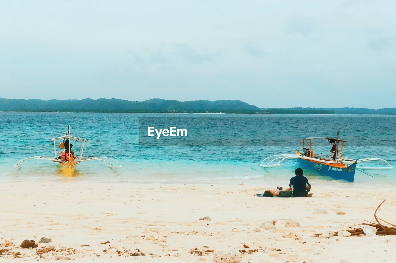 MAN ON BEACH