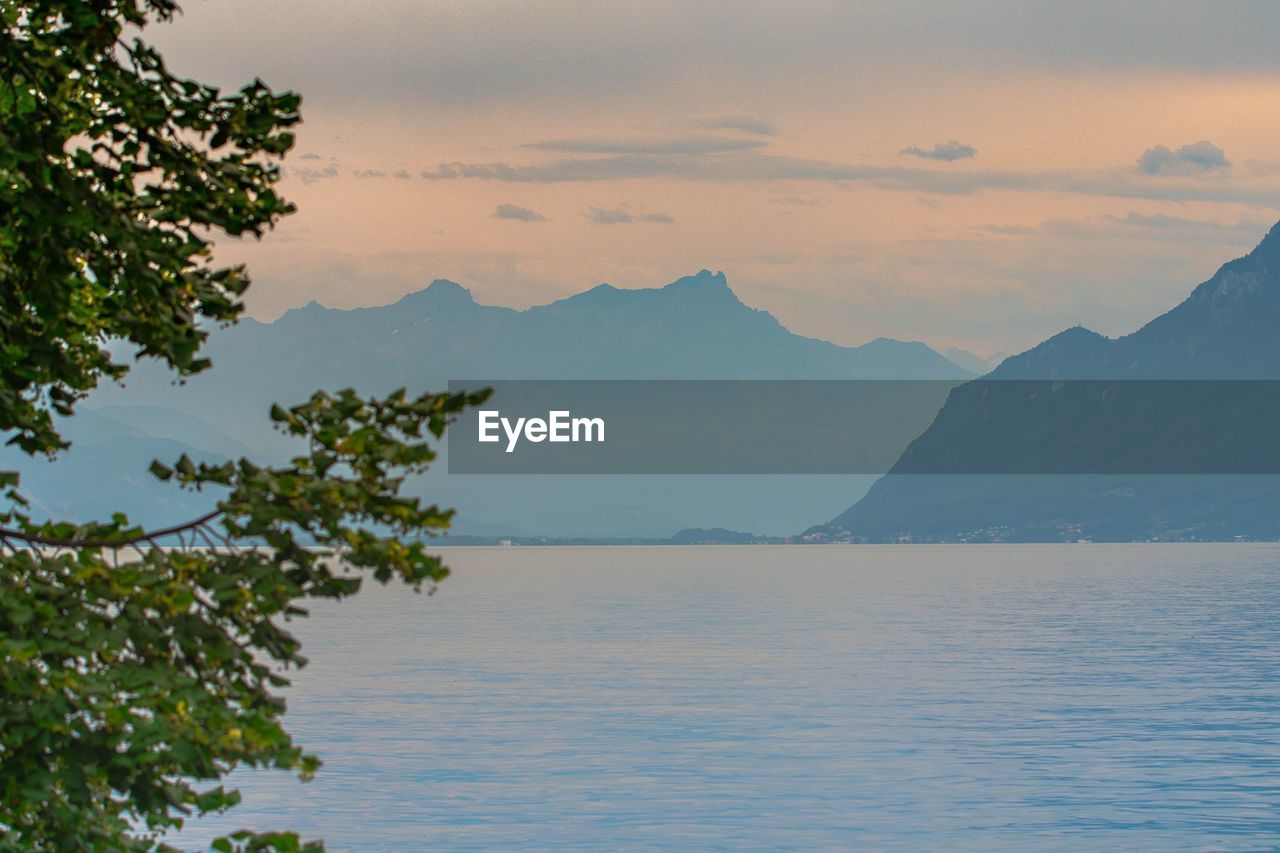 Scenic view of lake against sky during sunset