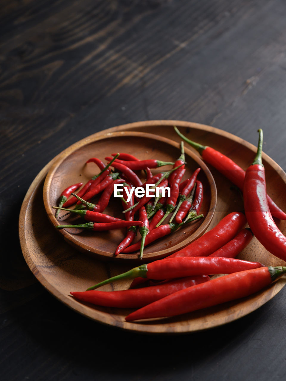 HIGH ANGLE VIEW OF RED CHILI PEPPERS IN BOWL