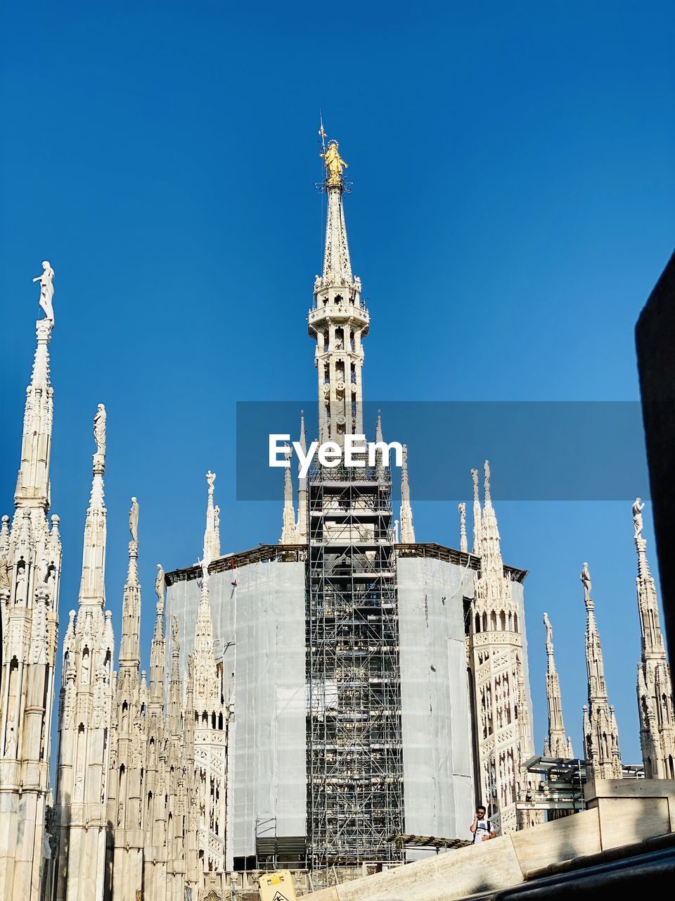 Low angle view of buildings against blue sky